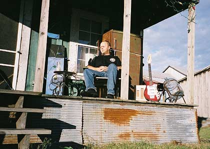 Mark sat on the porch of the Crossroads shack
