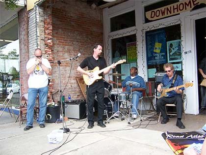 Mark playing with Quazimojo outside Cathead
